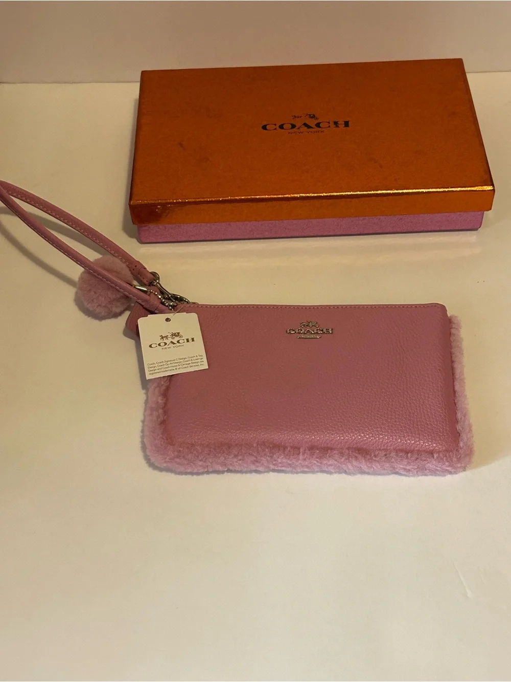 Coach Pink Shearling-Trim Wristlet Pouch